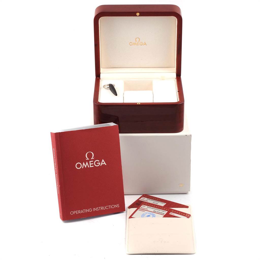 The image shows an Omega Speedmaster 326.30.40.50.01.001 Men
s Stainless Steel Black Dial 326.30.40.50.01.001 Men
s Stainless Steel Black Dial watch box, operating instructions booklet, and warranty cards.