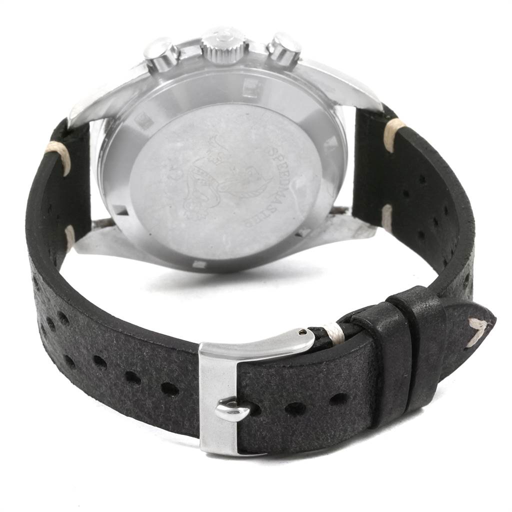 The image shows the back view of an Omega Speedmaster 145.012 Men
s Stainless Steel Black Dial 145.012 Men
s Stainless Steel Black Dial watch, highlighting its case back, pushers, crown, and leather strap with buckle.