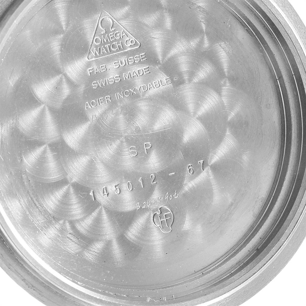 This image shows the inner case back of an Omega Speedmaster 145.012 Men
s Stainless Steel Black Dial 145.012 Men
s Stainless Steel Black Dial watch with model number 145012-67 and various inscriptions.