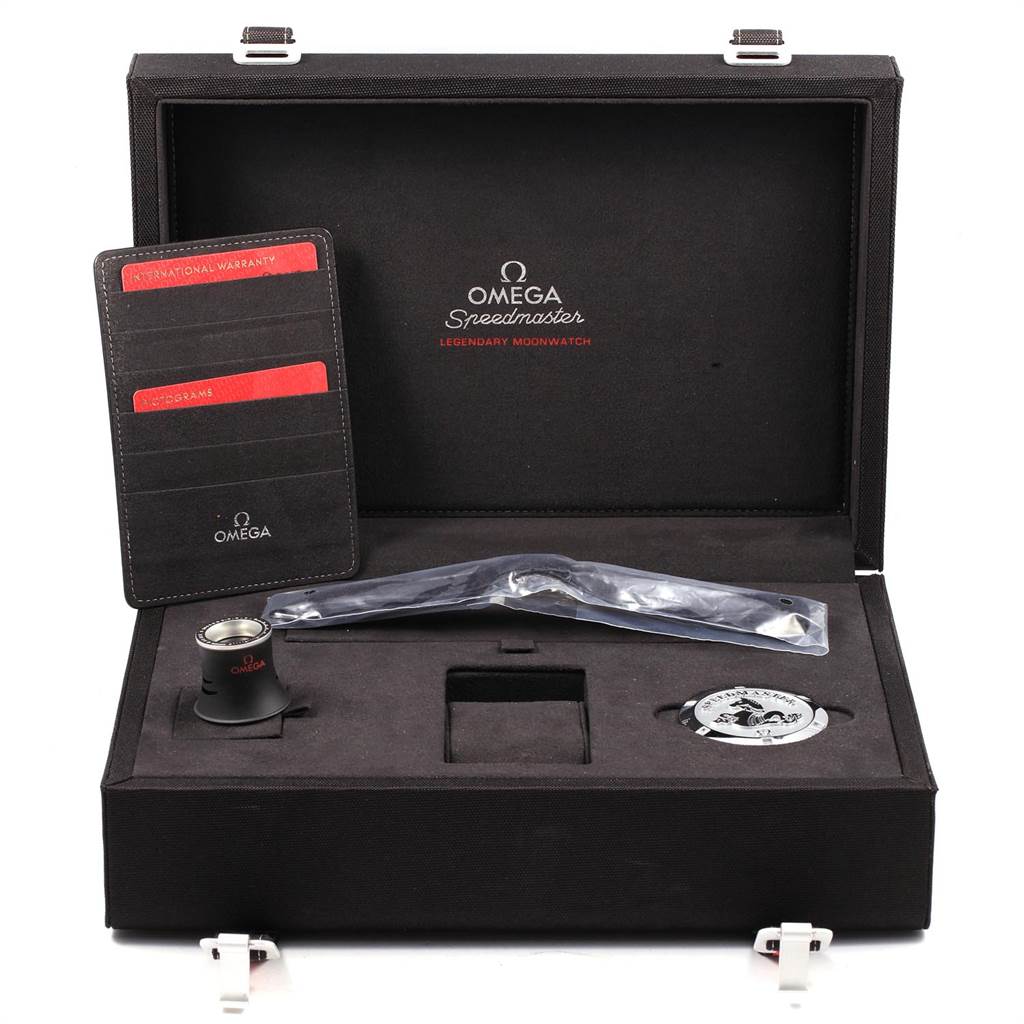 The image shows an Omega Speedmaster 311.30.42.30.01.005 Men
s Stainless Steel Black Dial 311.30.42.30.01.005 Men
s Stainless Steel Black Dial box containing a loupe, warranty cards, and additional watch accessories.