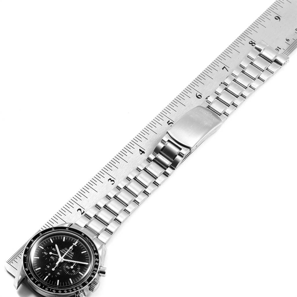 The Omega Speedmaster 3572.50.00 Men's Stainless Steel Black Dial 3572.50.00 Men's Stainless Steel Black Dial watch is shown from the front, displaying its face and metal bracelet alongside a ruler for scale.