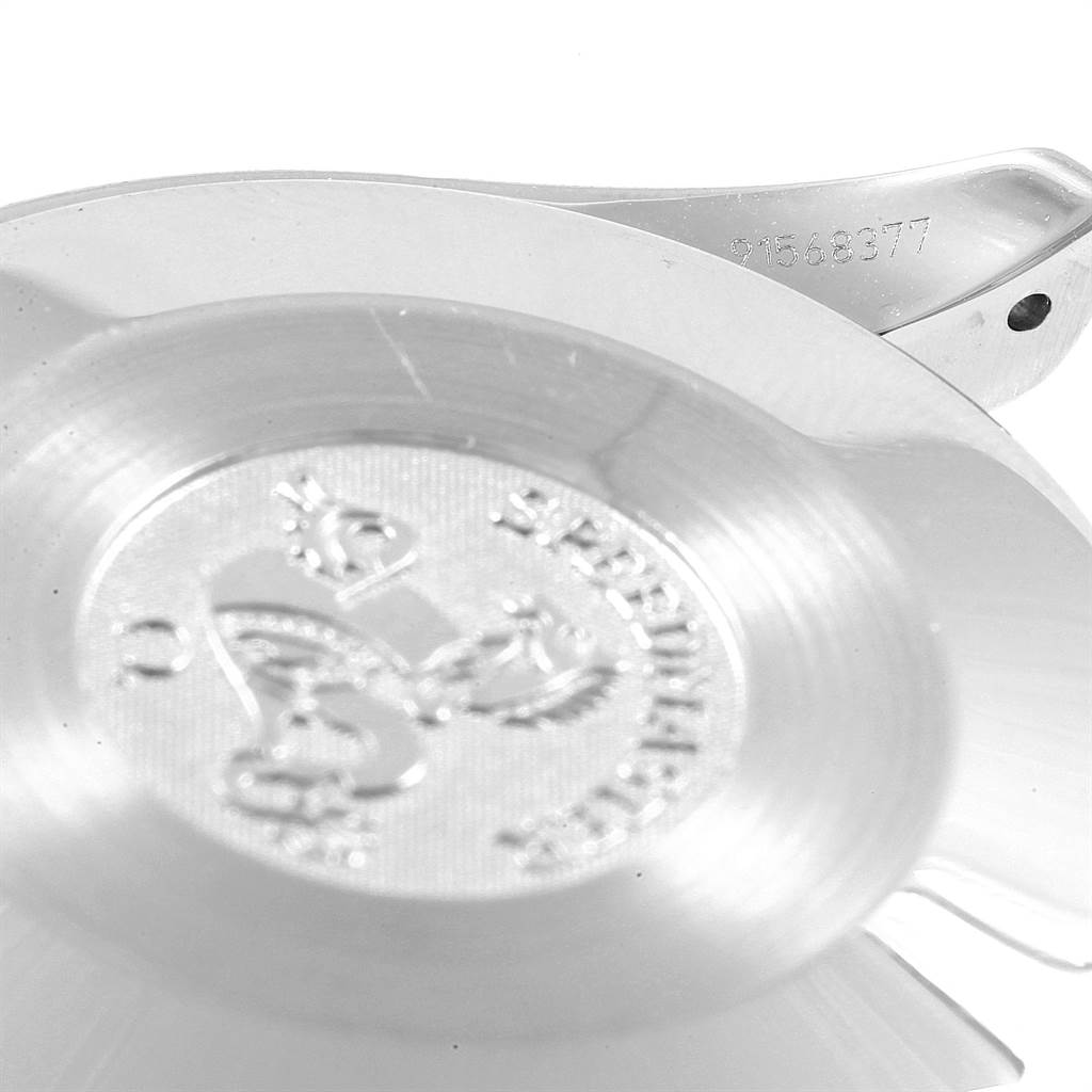 The image shows a close-up of the Omega Speedmaster 3539.50.00 Men
s Stainless Steel Black Dial 3539.50.00 Men
s Stainless Steel Black Dial case back and a partial view of the watch
s serial number on the lug.