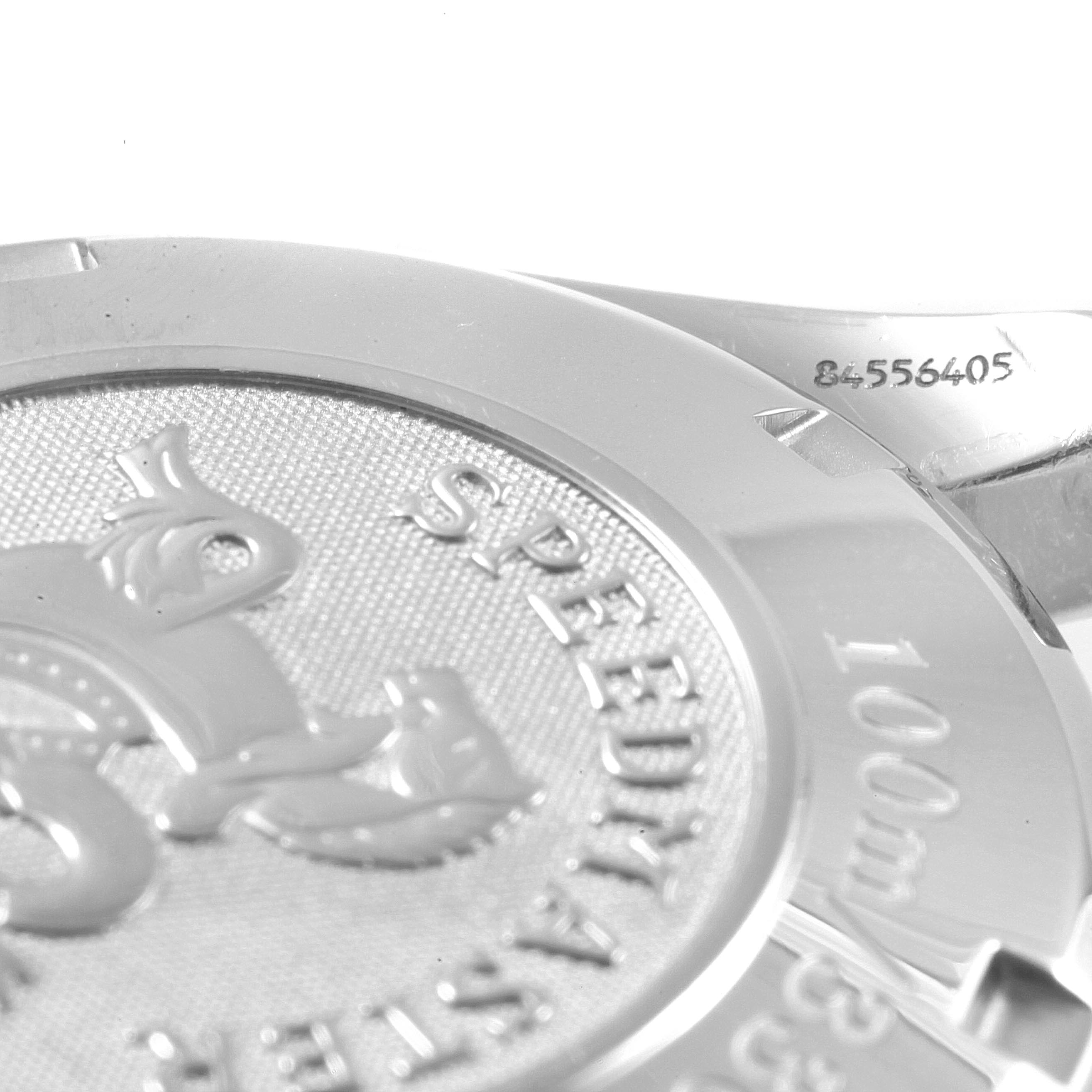 This image shows a close-up of the back casing and edge of the bezel of an Omega Speedmaster 3211.30.00 Men's Stainless Steel Silver Dial 3211.30.00 Men's Stainless Steel Silver Dial watch, including engraved details.