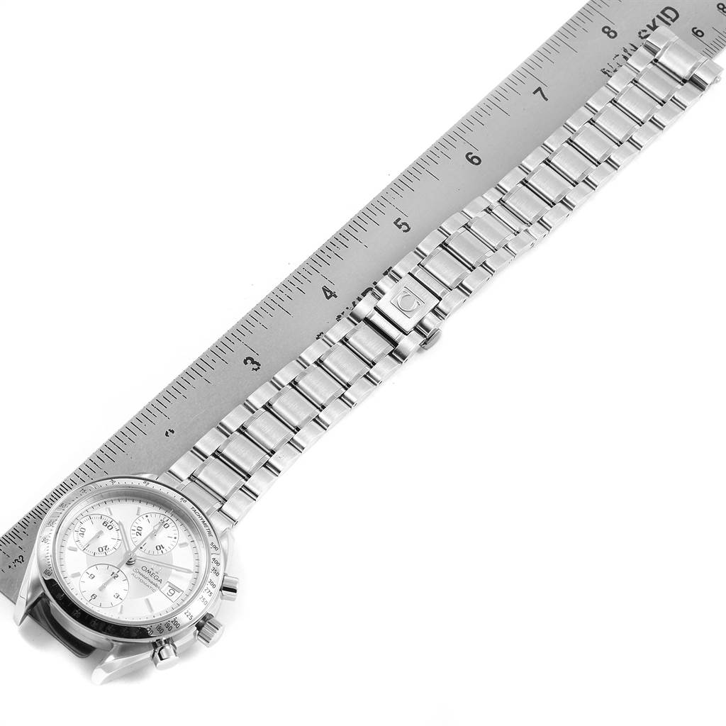 The image shows the Omega Speedmaster 3513.30.00 Men
s Stainless Steel Silver Dial 3513.30.00 Men
s Stainless Steel Silver Dial watch laid flat, highlighting the watch face, bracelet, clasp, and a ruler for measurement.