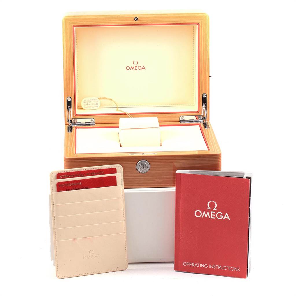 The image shows the open packaging box, warranty cards, and operating instructions for an Omega Speedmaster 321.10.44.50.01.001 Men
s Stainless Steel Black Dial 321.10.44.50.01.001 Men
s Stainless Steel Black Dial watch.