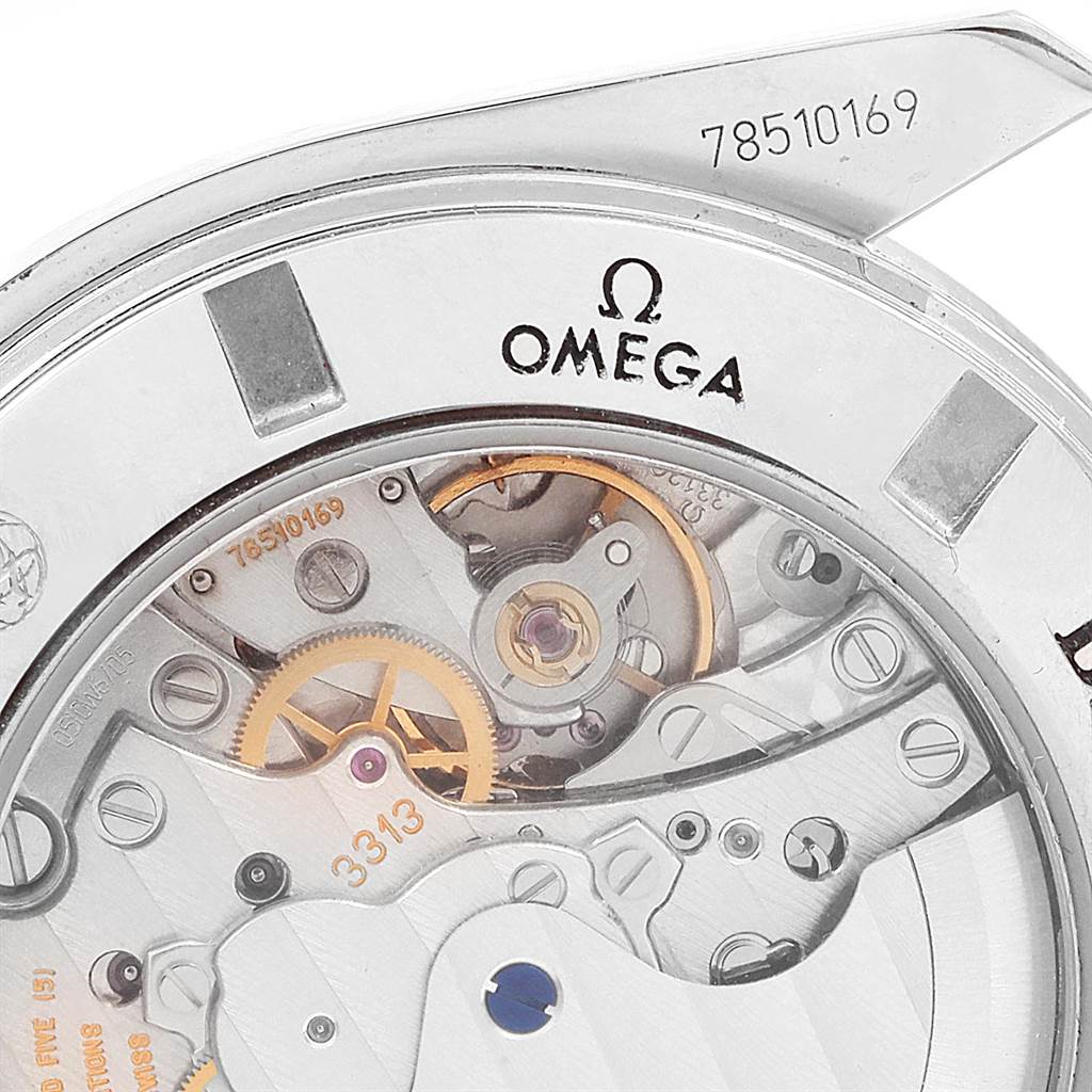 The image shows a close-up of the Omega Speedmaster 321.10.44.50.01.001 Men
s Stainless Steel Black Dial 321.10.44.50.01.001 Men
s Stainless Steel Black Dial watch
s movement and serial number from a back angle.