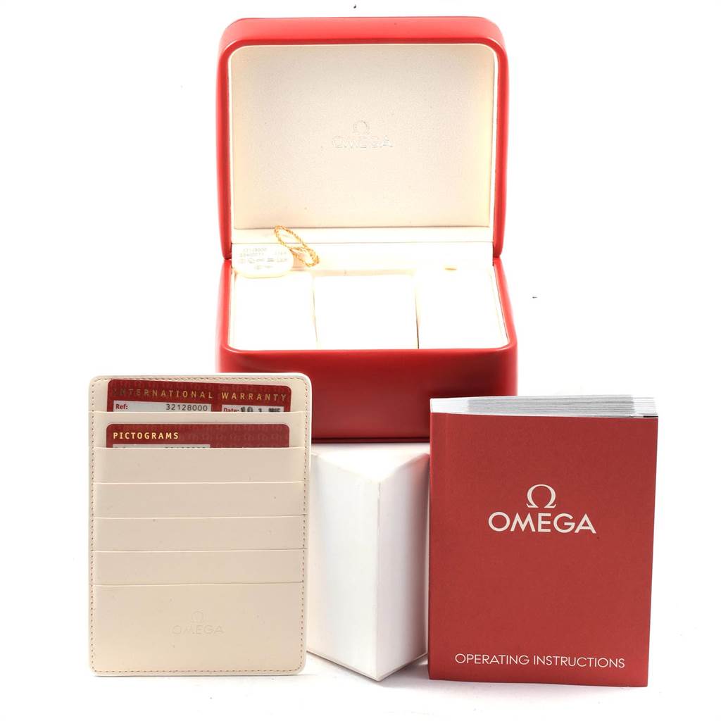 The image shows the accessories of an Omega Speedmaster 3212.80.00 Men
s Stainless Steel Blue Dial 3212.80.00 Men
s Stainless Steel Blue Dial, including the watch box, warranty cards, and operating instructions.