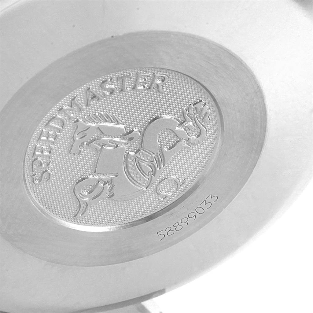 This image shows the engraved case back of an Omega Speedmaster 3513.50.00 Men
s Stainless Steel Black Dial 3513.50.00 Men
s Stainless Steel Black Dial watch with a dragon and text.