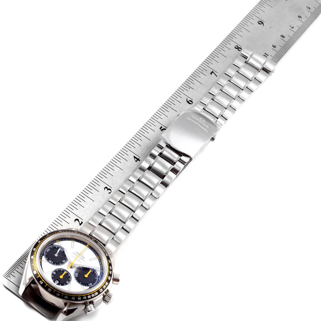 The image shows an Omega Speedmaster 326.30.40.50.04.001 Men
s Stainless Steel White Dial 326.30.40.50.04.001 Men
s Stainless Steel White Dial watch with a silver bracelet set against a ruler to measure its length.