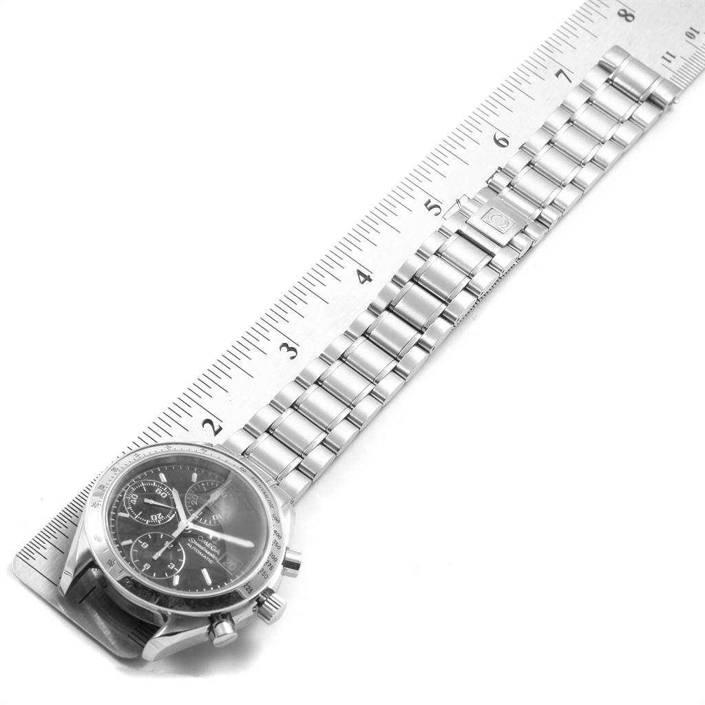 The image shows an Omega Speedmaster 3513.50.00 Men
s Stainless Steel Black Dial 3513.50.00 Men
s Stainless Steel Black Dial watch bracelet measured alongside a ruler, focusing on the band and clasp.