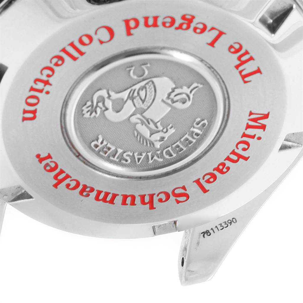 The image shows the back case of an Omega Speedmaster 3507.51.00 Men
s Stainless Steel Black Dial 3507.51.00 Men
s Stainless Steel Black Dial watch from a tilted angle, highlighting the Michael Schumacher Legend Collection engraving.