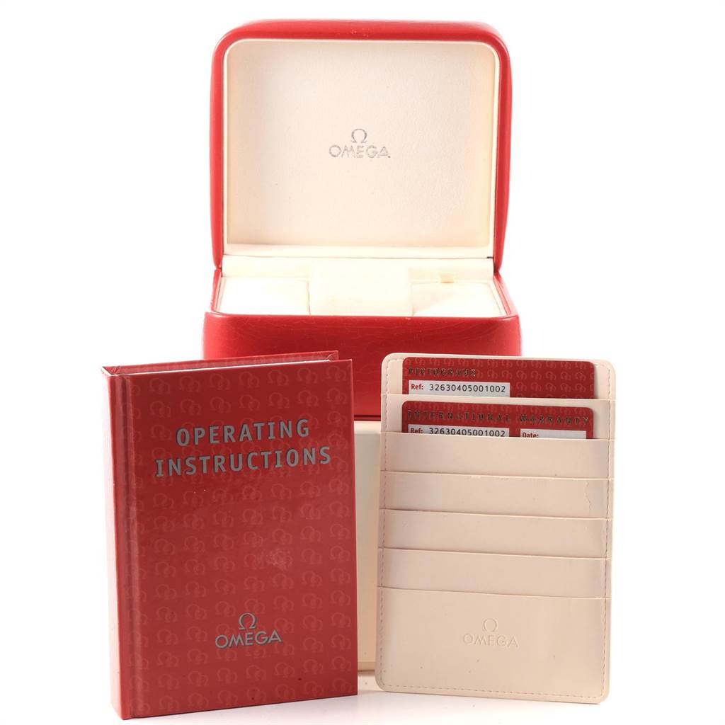 The image shows the packaging, operating instructions, and warranty cards for the Omega Speedmaster 326.30.40.50.01.002 Men
s Stainless Steel Black Dial 326.30.40.50.01.002 Men
s Stainless Steel Black Dial watch.