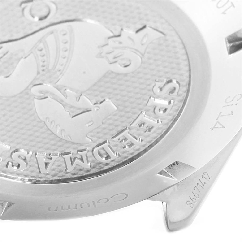 This close-up image shows the engraved case back of an Omega Speedmaster 327.10.43.50.01.001 Men
s Stainless Steel Black Dial 327.10.43.50.01.001 Men
s Stainless Steel Black Dial watch, highlighting the emblem and partial text.