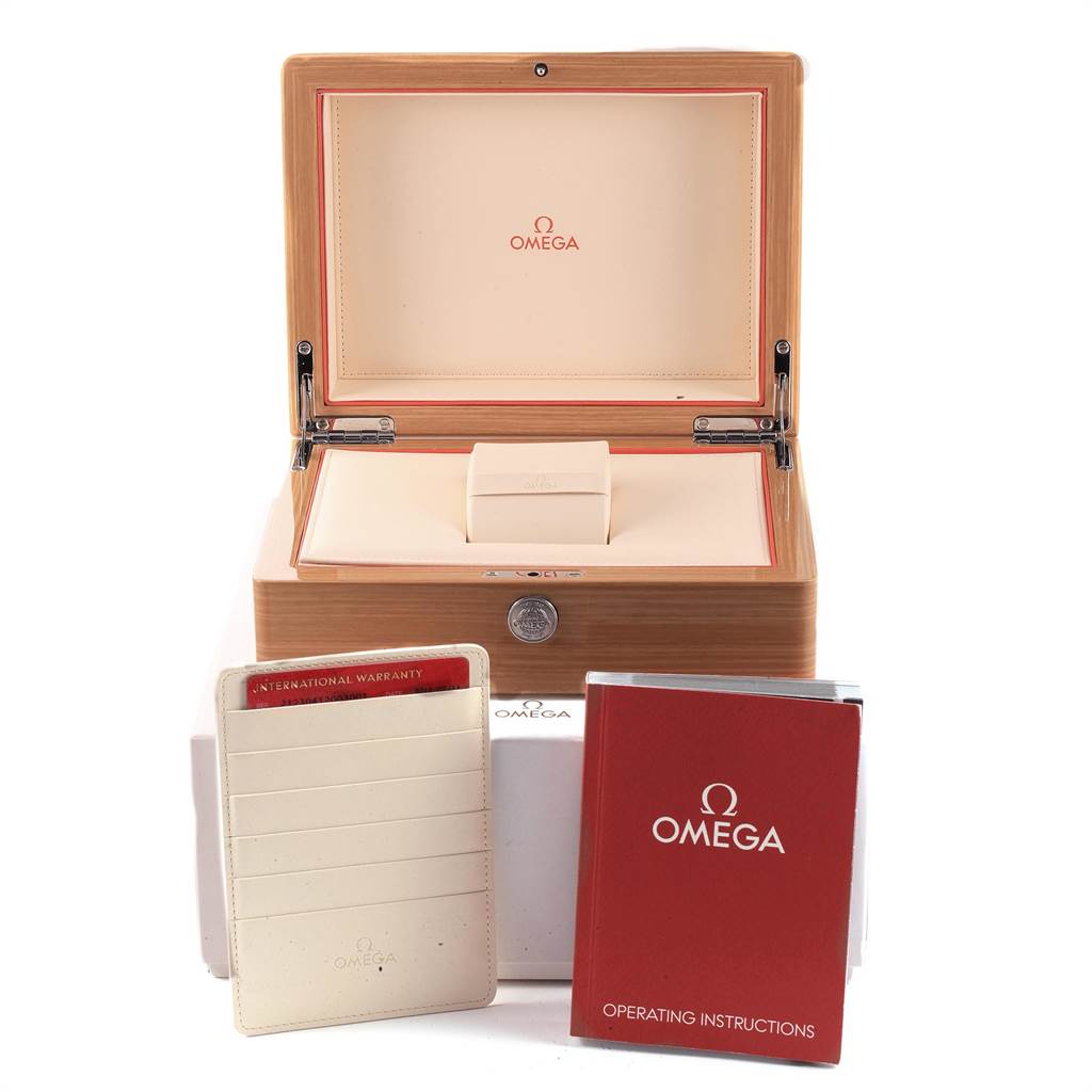 The image shows an open Omega Speedmaster 212.30.41.20.03.001 Men
s Stainless Steel Blue Dial 212.30.41.20.03.001 Men
s Stainless Steel Blue Dial watch box with an international warranty card and operating instructions.