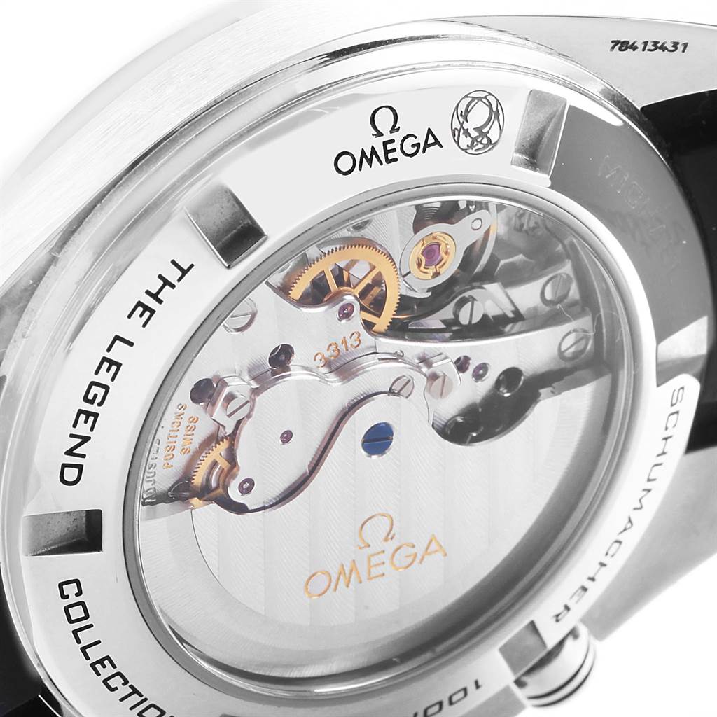 This image shows the case back and internal movement of the Omega Speedmaster 321.32.44.50.01.001 Men's Stainless Steel Black Dial 321.32.44.50.01.001 Men's Stainless Steel Black Dial model, featuring visible gears and "The Legend" inscription.