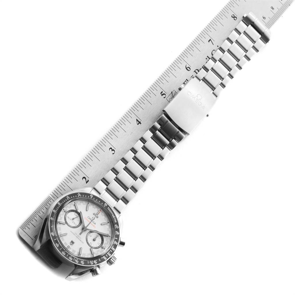 The Omega Speedmaster 329.30.44.51.04.001 Men
s Stainless Steel White Dial 329.30.44.51.04.001 Men
s Stainless Steel White Dial watch is displayed horizontally, showing the face, bezel, and metal bracelet alongside a ruler for scale.