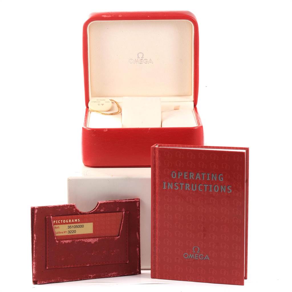 The image shows Omega Speedmaster 3510.50.00 Men
s Stainless Steel Black Dial 3510.50.00 Men
s Stainless Steel Black Dial accessories including a red watch box, operating instructions, and a pictogram card.