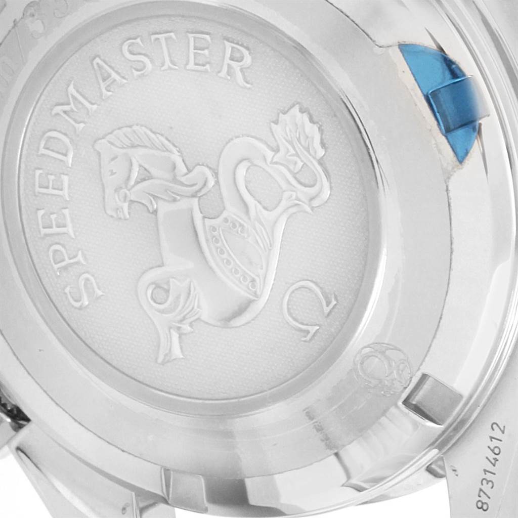 The image shows the back case of an Omega Speedmaster 323.30.40.40.06.001 Men
s Stainless Steel Grey Dial 323.30.40.40.06.001 Men
s Stainless Steel Grey Dial watch, highlighting the engraved Speedmaster logo and serial number.