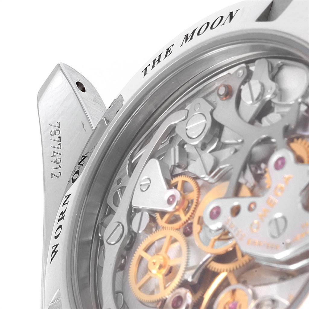 This image shows a close-up side view of the Omega Speedmaster 3573.50.00 Men's Stainless Steel Black Dial 3573.50.00 Men's Stainless Steel Black Dial watch's open case back, revealing the intricate movement gears.