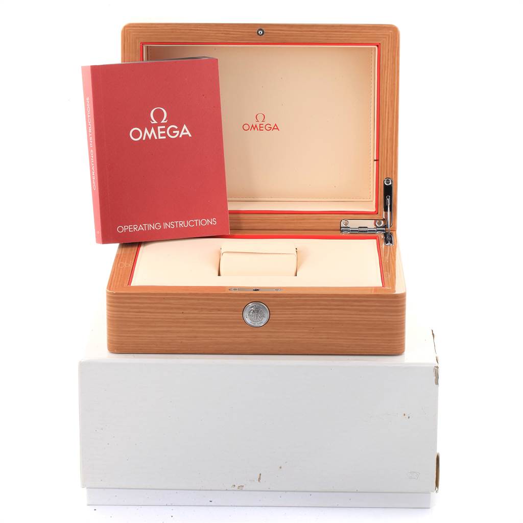 The image shows the box and operating instructions for the Omega Speedmaster 3573.50.00 Men's Stainless Steel Black Dial 3573.50.00 Men's Stainless Steel Black Dial watch.