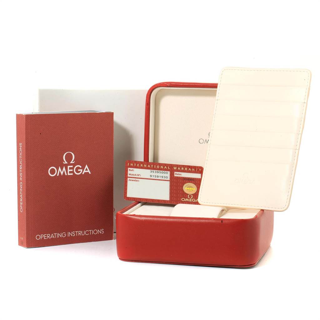 The image shows the packaging and accessories for an Omega Speedmaster 3539.50.00 Men
s Stainless Steel Black Dial 3539.50.00 Men
s Stainless Steel Black Dial, including the instruction manual, warranty card, and red case.