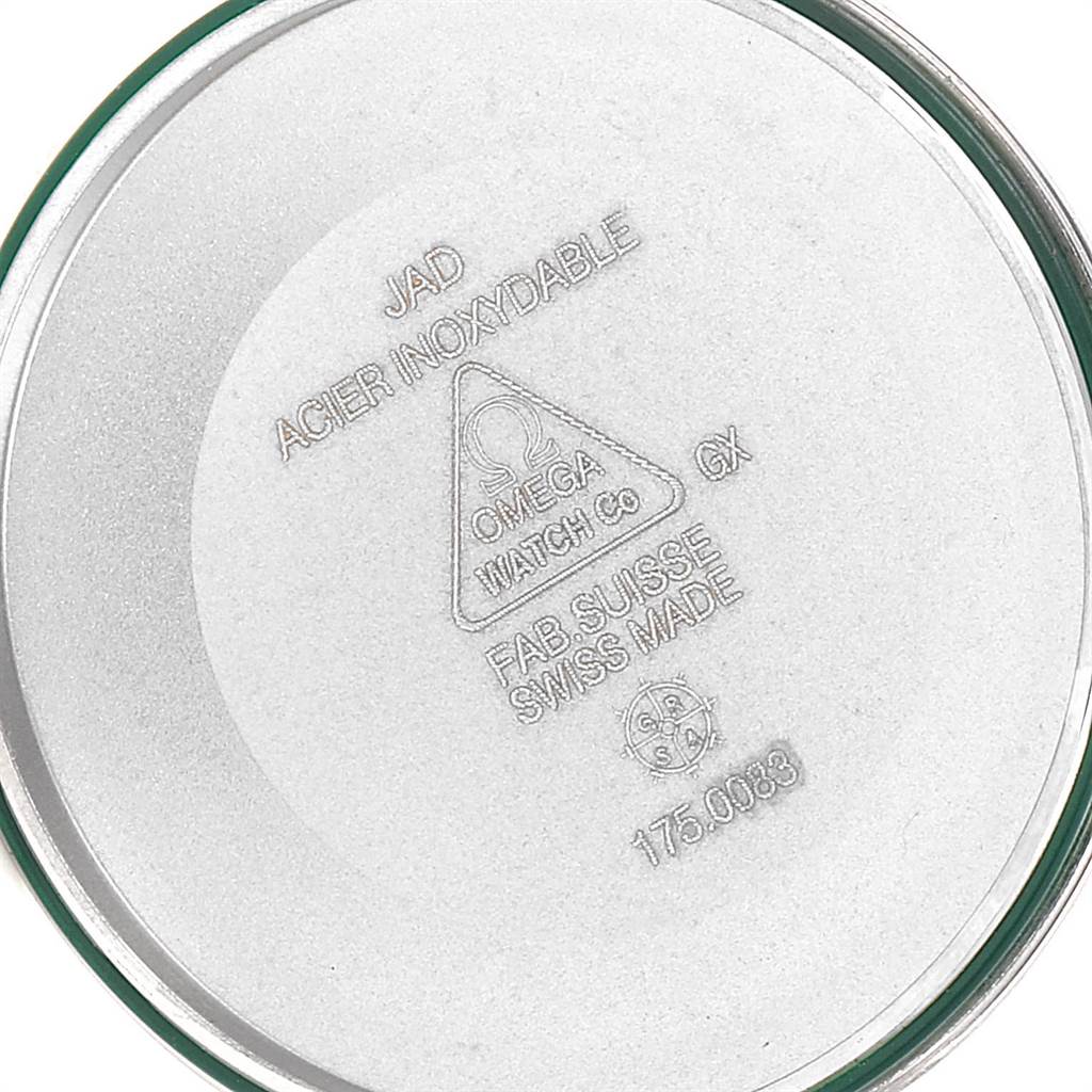 The image shows the back case of an Omega Speedmaster 3513.46.00 Men
s Stainless Steel Blue Dial 3513.46.00 Men
s Stainless Steel Blue Dial watch, displaying engravings and a metal texture.