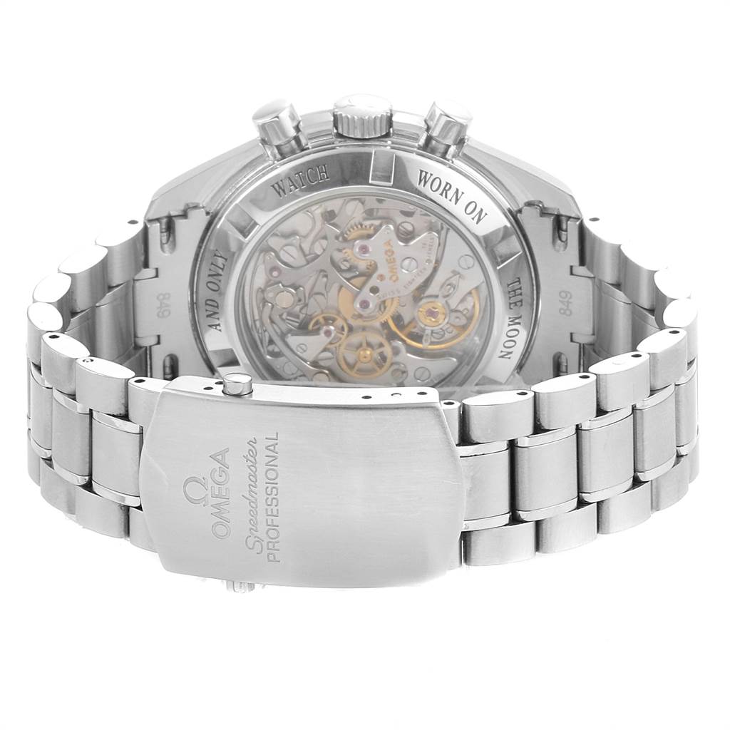 The image shows the back of the Omega Speedmaster 3573.50.00 Men
s Stainless Steel Black Dial 3573.50.00 Men
s Stainless Steel Black Dial watch, highlighting the movement through the transparent case back and the bracelet clasp.