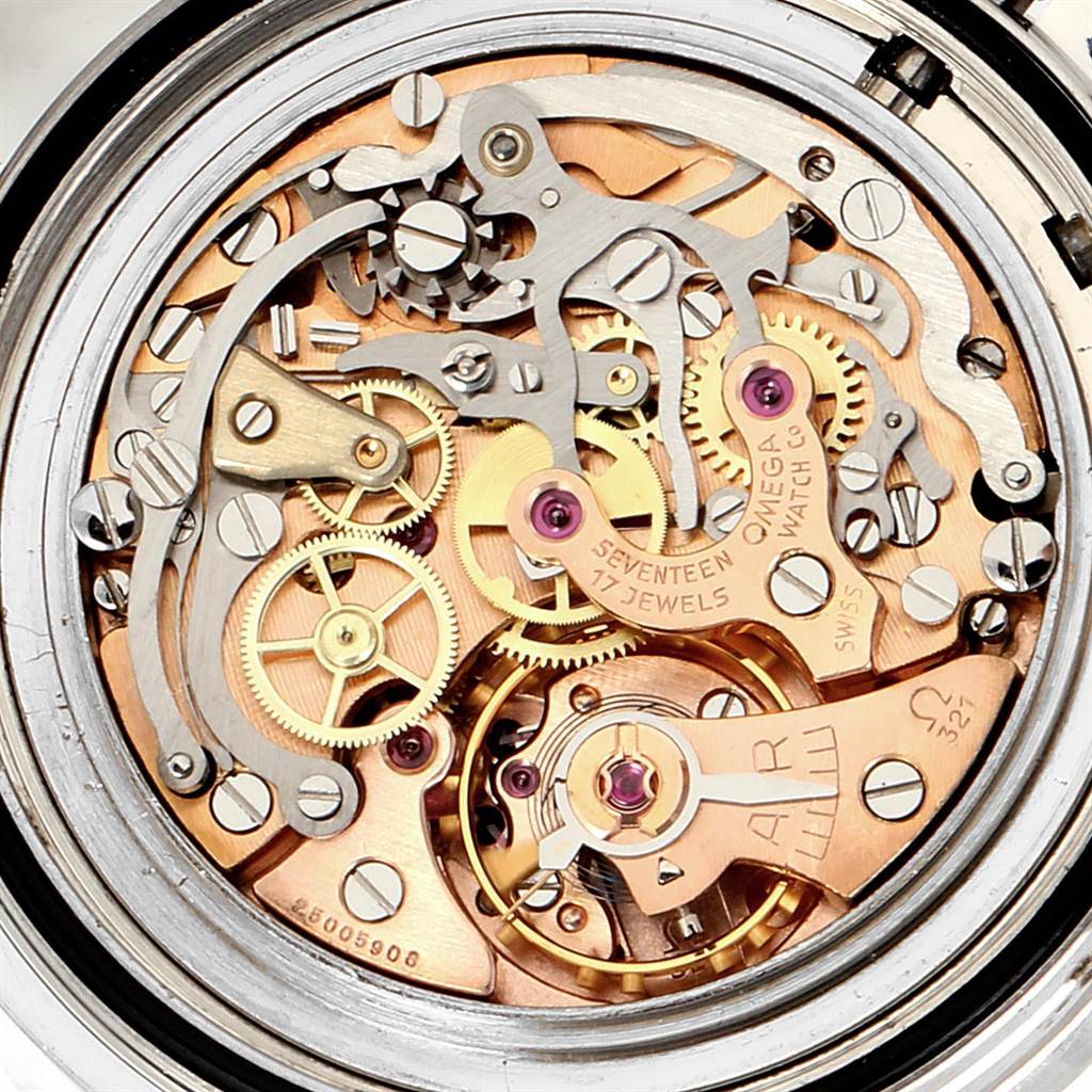 The image shows the intricate internal mechanism of an Omega Speedmaster 145.012 Men's Stainless Steel Black Dial 145.012 Men's Stainless Steel Black Dial watch from a rear angle, revealing the gears, jewels, and other components.