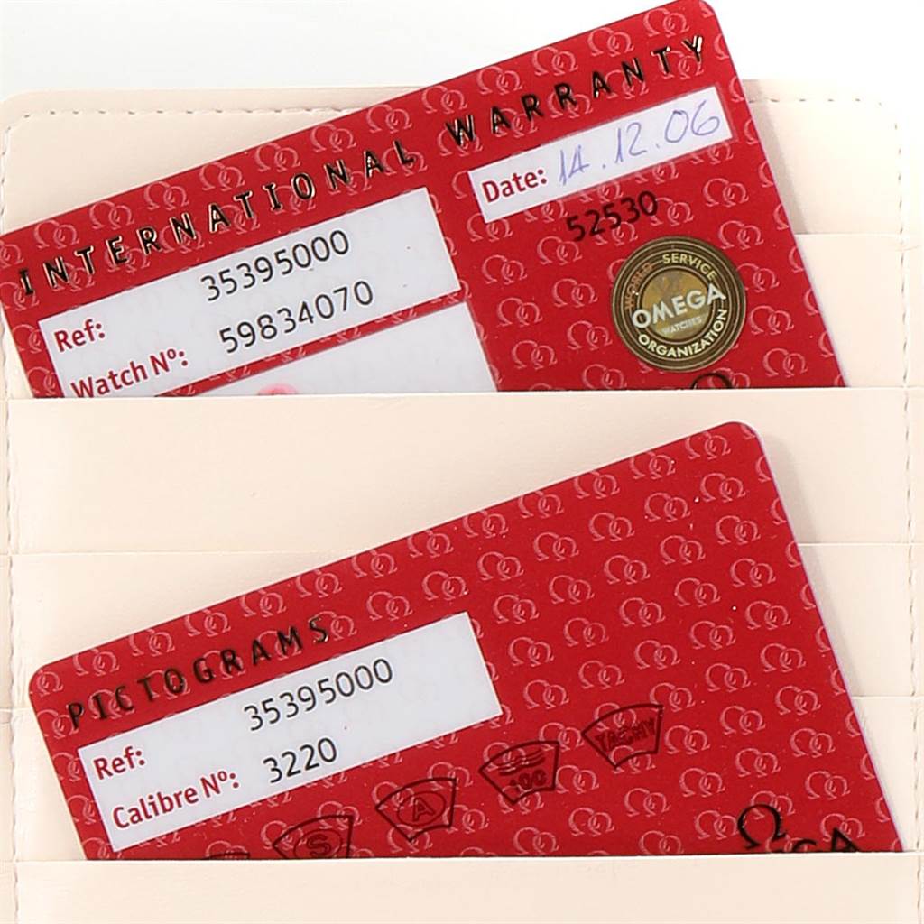 The image shows warranty and pictogram cards for an Omega Speedmaster 3539.50.00 Men
s Stainless Steel Black Dial 3539.50.00 Men
s Stainless Steel Black Dial watch.