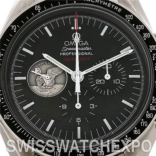 The image shows a close-up of the Omega Speedmaster 311.   30.   42.   30.   01.   002 Men
s Stainless Steel Black Dial 311.   30.   42.   30.   01.   002 Men
s Stainless Steel Black Dial Professional OMEGA 02:59 GMT dial and bezel, highlighting the Apollo mission emblem.