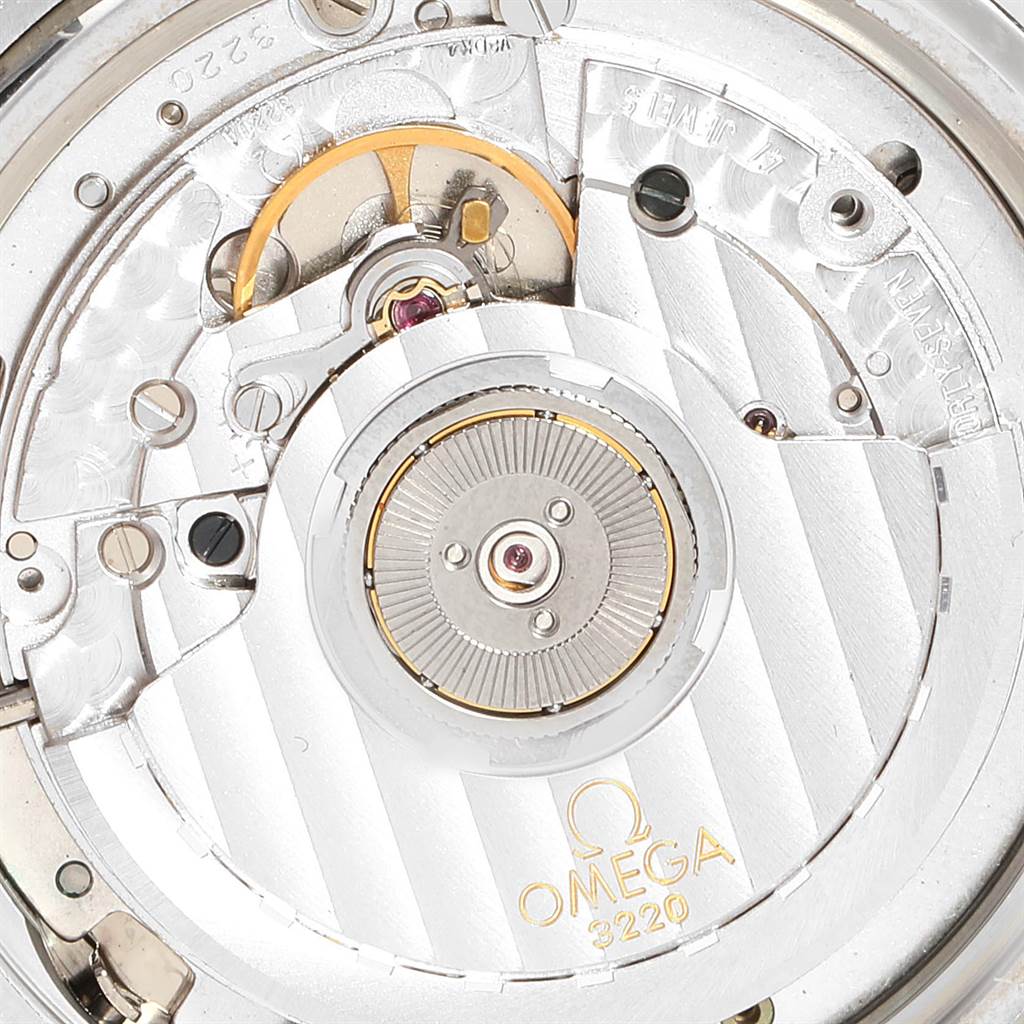 The image shows a close-up view of the Omega Speedmaster 3539.50.00 Men
s Stainless Steel Black Dial 3539.50.00 Men
s Stainless Steel Black Dial
s movement, specifically the intricate internal mechanisms.