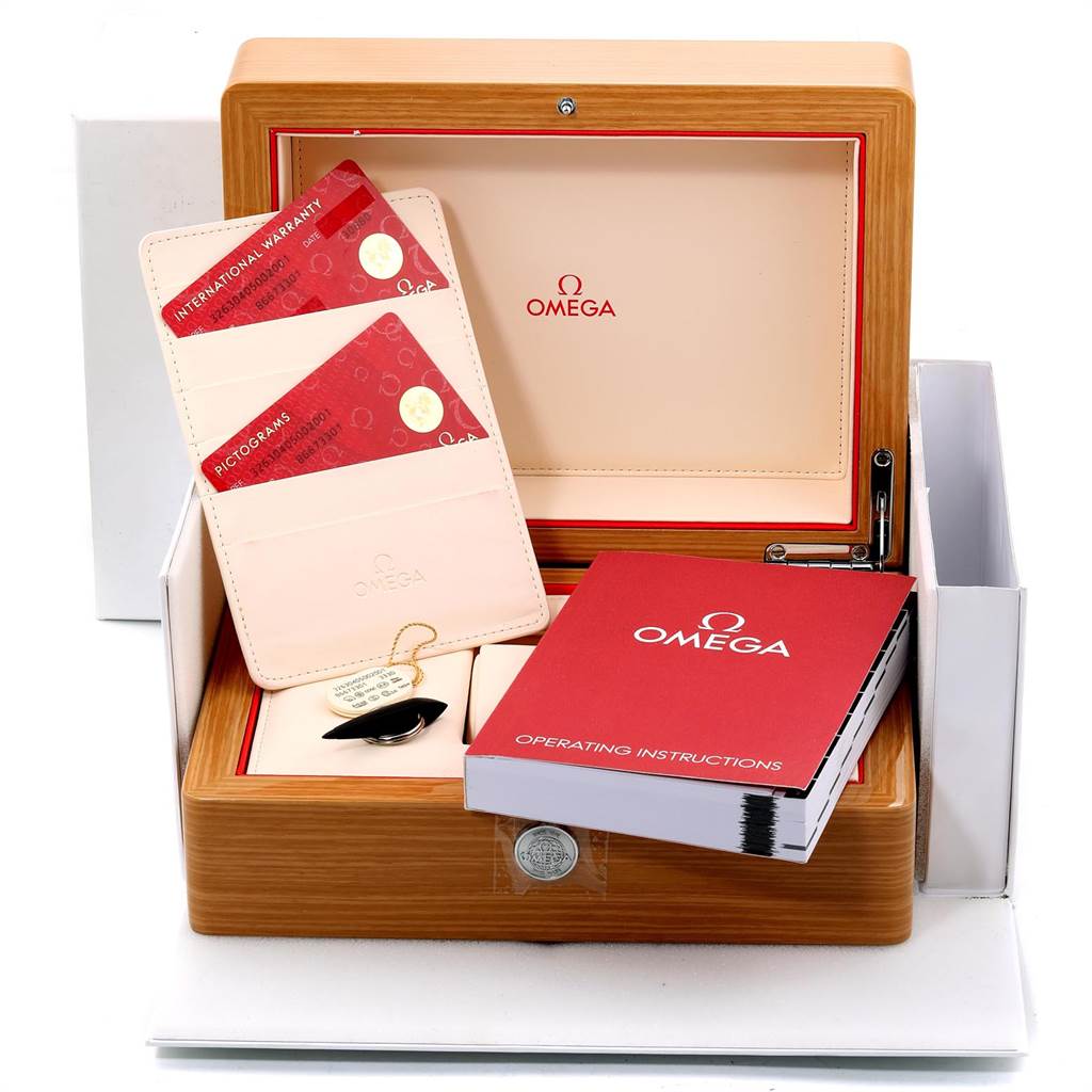 The image shows an Omega Speedmaster 326.30.40.50.02.001 Men
s Stainless Steel Silver Dial 326.30.40.50.02.001 Men
s Stainless Steel Silver Dial watch box, international warranty cards, and an operating instructions booklet.