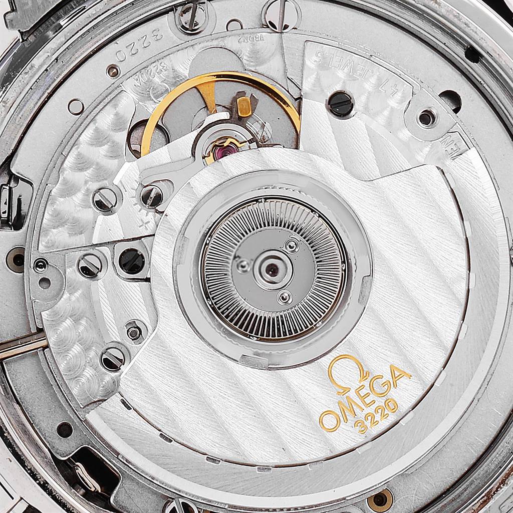 The image shows a close-up view of the movement mechanism of an Omega Speedmaster 3539.50.00 Men
s Stainless Steel Black Dial 3539.50.00 Men
s Stainless Steel Black Dial watch, highlighting the rotor and other intricate parts.