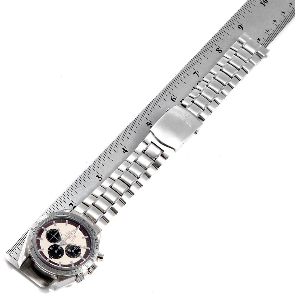 The Omega Speedmaster 3559.32.00 Men's Stainless Steel Silver Dial 3559.32.00 Men's Stainless Steel Silver Dial watch is shown from above, featuring its face, bracelet, and clasp, alongside a ruler for scale.