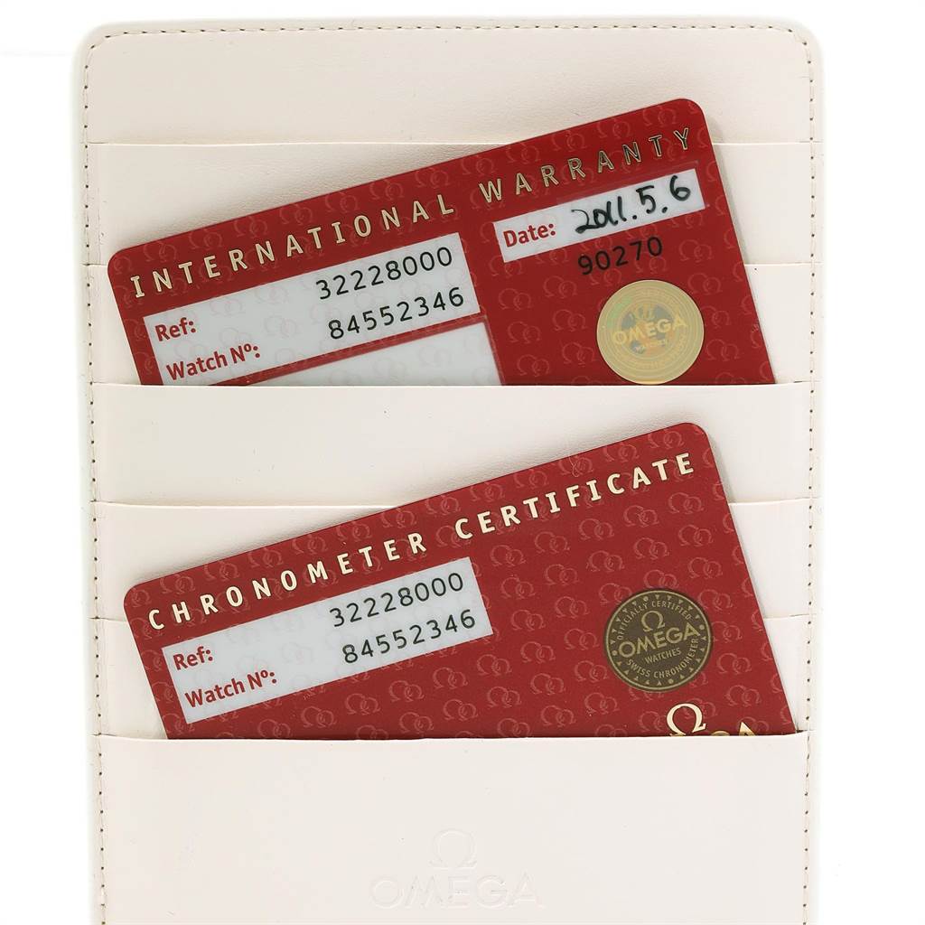 This image shows the international warranty and chronometer certificate cards for the Omega Speedmaster 3222.80.00 Men
s Stainless Steel Blue Dial 3222.80.00 Men
s Stainless Steel Blue Dial watch.