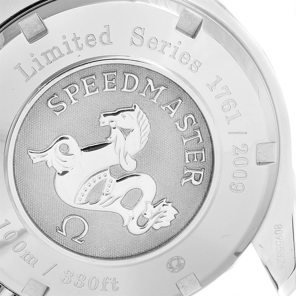 The image shows the case back of an Omega Speedmaster 323.30.40.40.02.001 Men
s Stainless Steel White Dial 323.30.40.40.02.001 Men
s Stainless Steel White Dial Limited Series watch, highlighting engravings and the emblem.