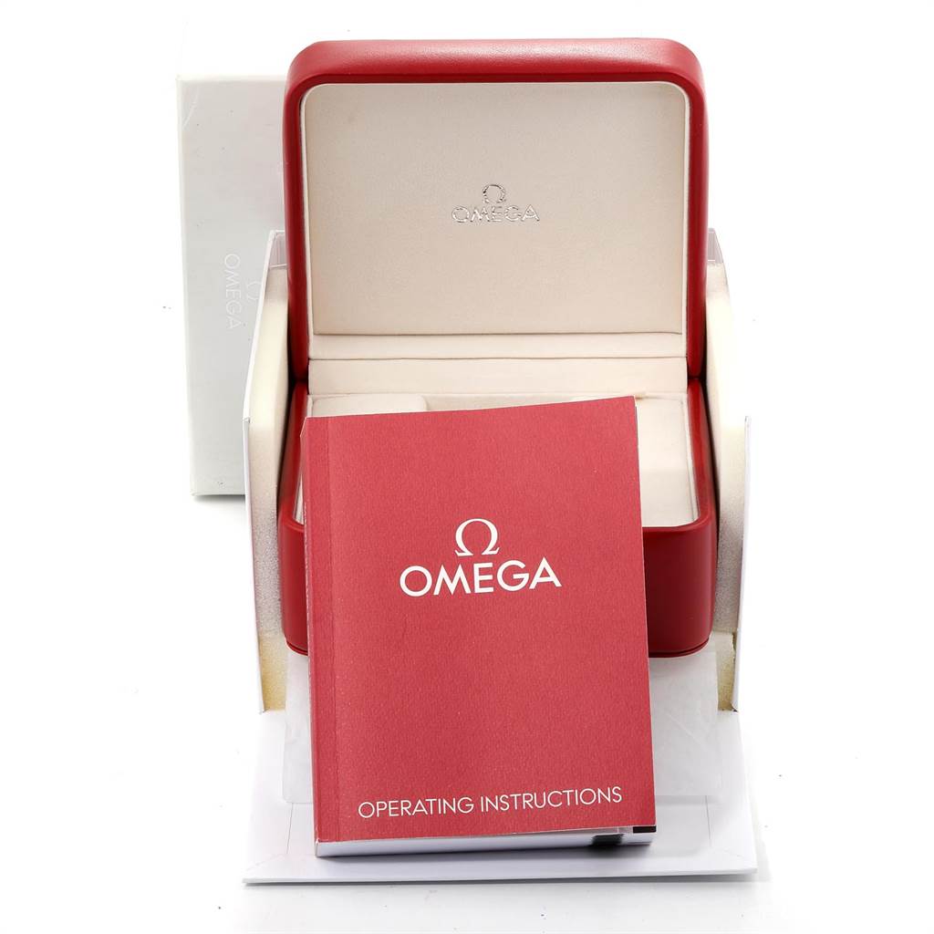 This image shows the Omega Speedmaster 323.30.40.40.02.001 Men
s Stainless Steel White Dial 323.30.40.40.02.001 Men
s Stainless Steel White Dial
s empty watch box and its red operating instructions manual.