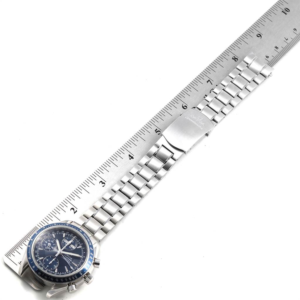 This image shows an Omega Speedmaster 3222.80.00 Men
s Stainless Steel Blue Dial 3222.80.00 Men
s Stainless Steel Blue Dial watch measured against a ruler, displaying the full bracelet and watch face from a top-down angle.