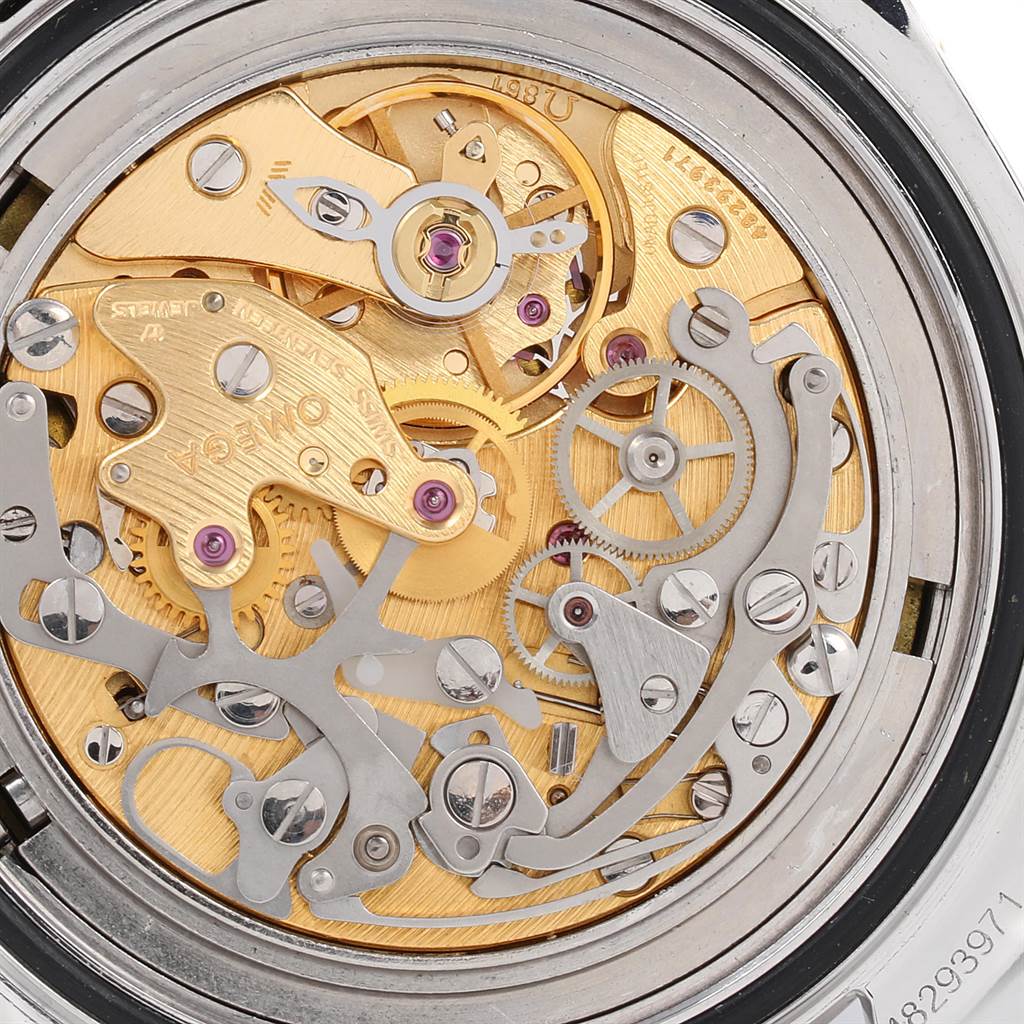 The image shows a close-up view of the intricate inner workings and movement of an Omega Speedmaster Men's Stainless Steel Black Dial Men's Stainless Steel Black Dial watch.