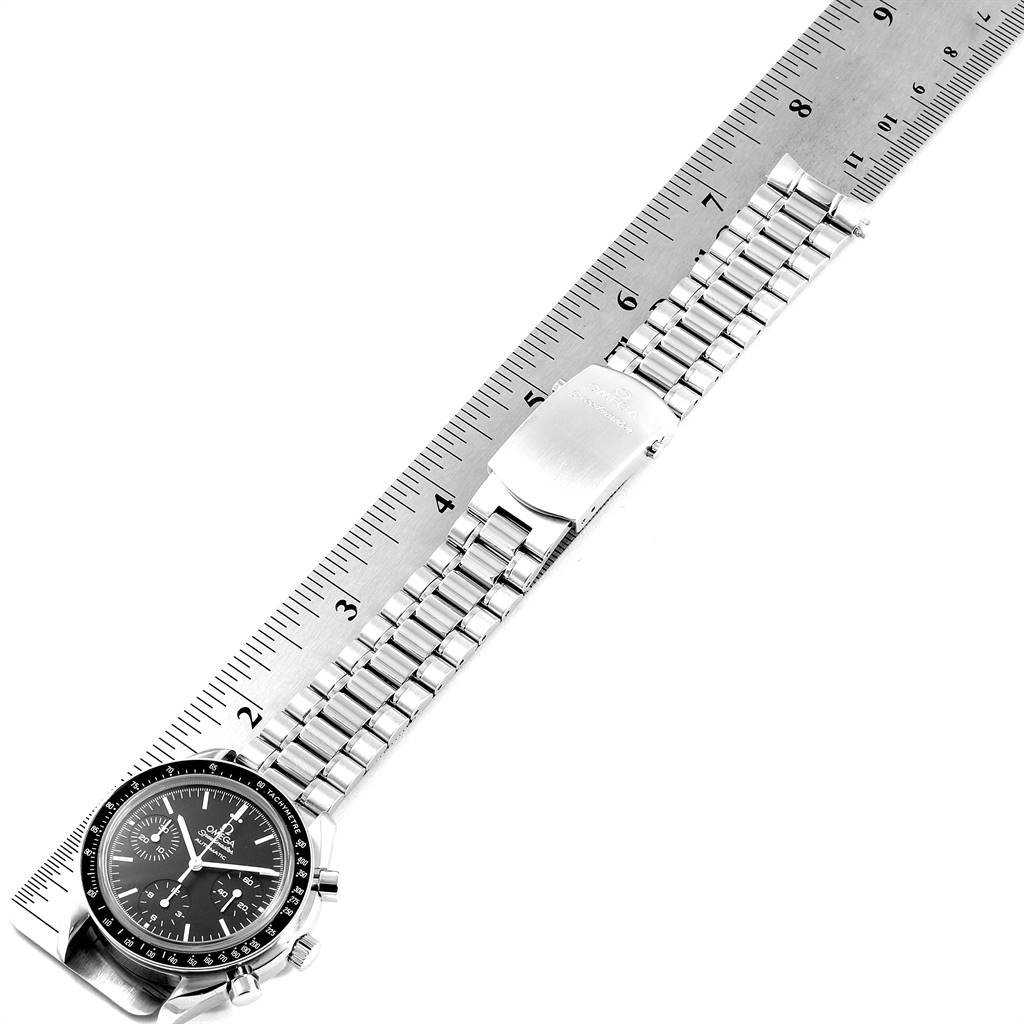 The Omega Speedmaster 3539.50.00 Men
s Stainless Steel Black Dial 3539.50.00 Men
s Stainless Steel Black Dial watch is shown flat, alongside a measuring ruler, displaying the face, bracelet, and clasp.