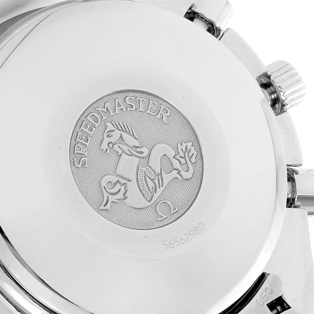 The image shows the back case of an Omega Speedmaster 3523.80.00 Men
s Stainless Steel Blue Dial 3523.80.00 Men
s Stainless Steel Blue Dial watch, highlighting the engraved logo and serial number.