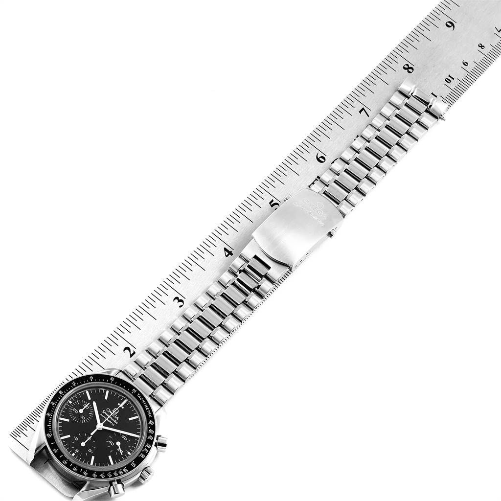 This image shows a top-down view of an Omega Speedmaster 3539.50.00 Men
s Stainless Steel Black Dial 3539.50.00 Men
s Stainless Steel Black Dial watch and its bracelet with a ruler measuring its length.