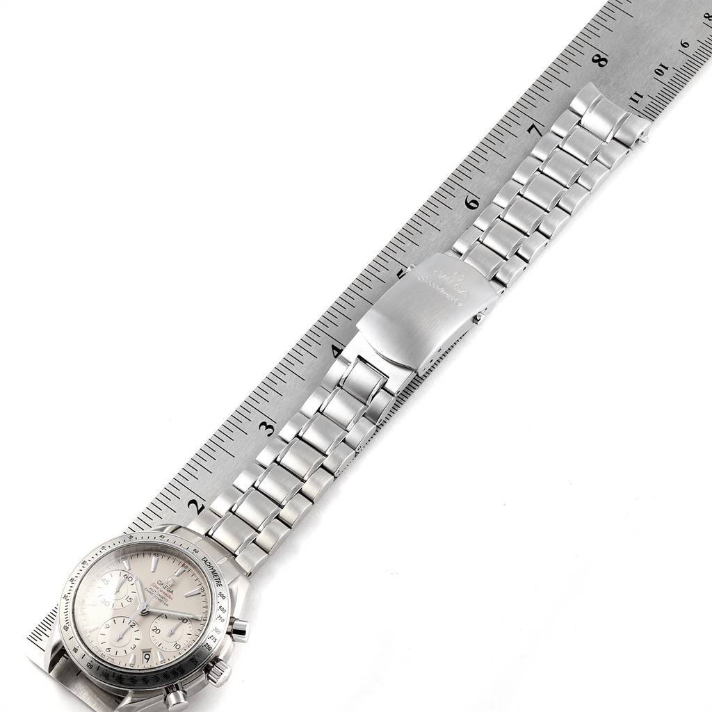 The image shows an Omega Speedmaster 323.10.40.40.02.001 Men
s Stainless Steel Silver Dial 323.10.40.40.02.001 Men
s Stainless Steel Silver Dial watch laid flat, with a metal bracelet clasp and ruler for size reference.
