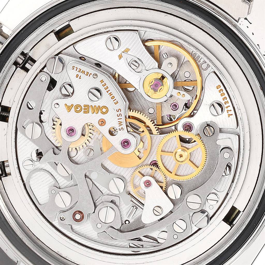 This image shows the back of an Omega Speedmaster 3570.50.00 Men's Stainless Steel Black Dial 3570.50.00 Men's Stainless Steel Black Dial watch, revealing the intricate mechanical movement and gears inside.