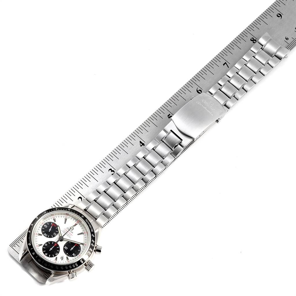 The image shows an Omega Speedmaster 323.30.40.40.04.001 Men
s Stainless Steel White Dial 323.30.40.40.04.001 Men
s Stainless Steel White Dial watch laid flat, with the face, bracelet, and clasp visible alongside a ruler for size reference.