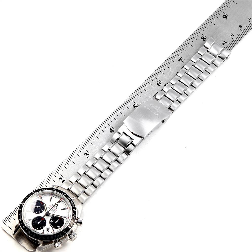 The image shows an Omega Speedmaster 323.30.40.40.04.001 Men
s Stainless Steel White Dial 323.30.40.40.04.001 Men
s Stainless Steel White Dial watch from a top-down angle, focusing on the face and bracelet, placed next to a ruler.