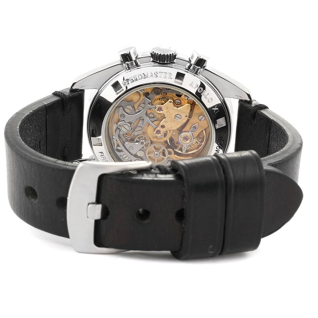 The image shows the back view of the Omega Speedmaster 3570.50.00 Men
s Stainless Steel Black Dial 3570.50.00 Men
s Stainless Steel Black Dial watch, highlighting the intricate movement and leather strap with a buckle.