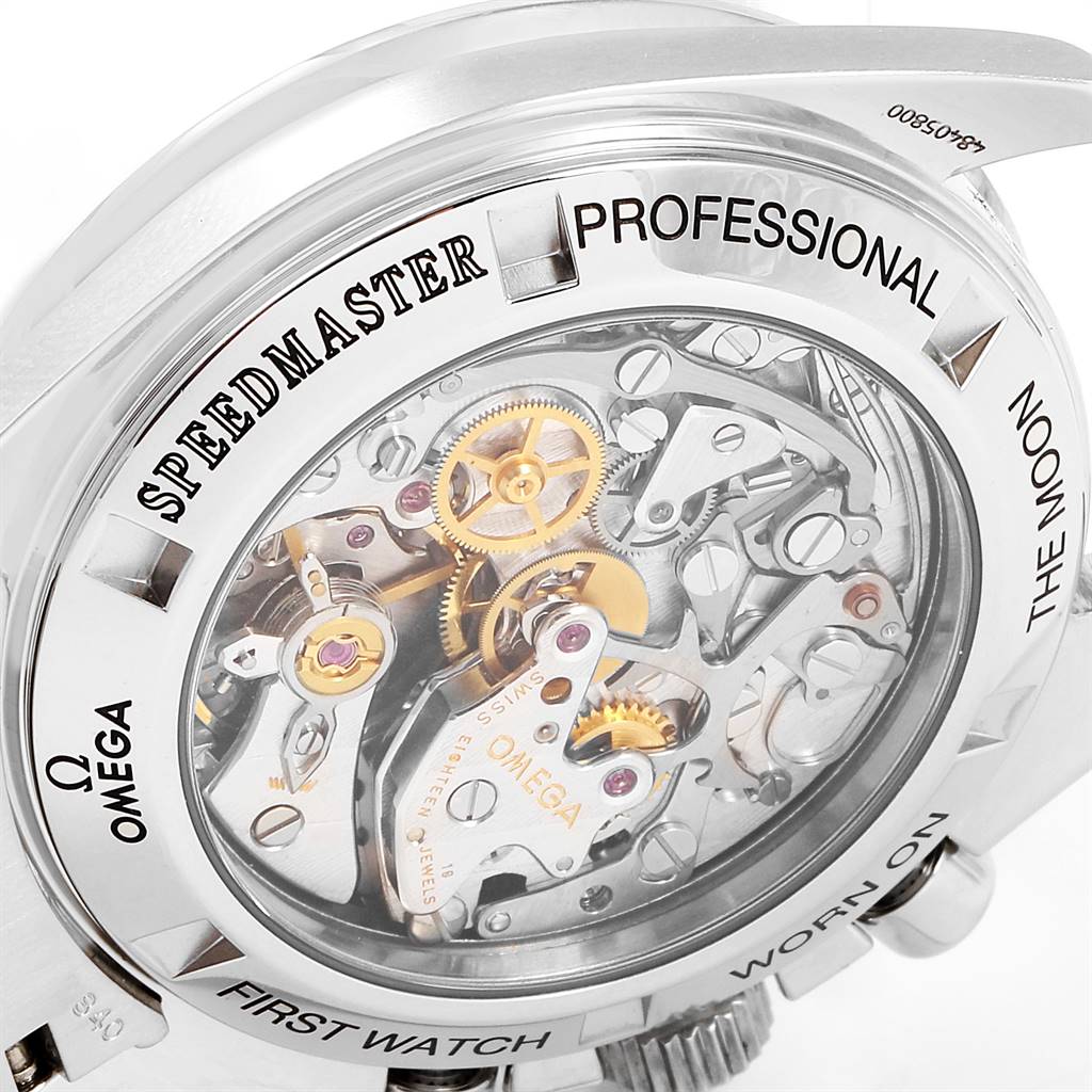 The image shows the back view of an Omega Speedmaster 3572.50.00 Men
s Stainless Steel Black Dial 3572.50.00 Men
s Stainless Steel Black Dial watch, highlighting its intricate mechanical movement.