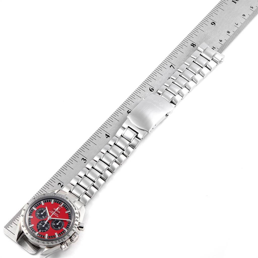 The image shows an Omega Speedmaster 3506.61.00 Men's Stainless Steel Red Dial 3506.61.00 Men's Stainless Steel Red Dial watch positioned flat alongside a ruler, displaying its full face and bracelet.