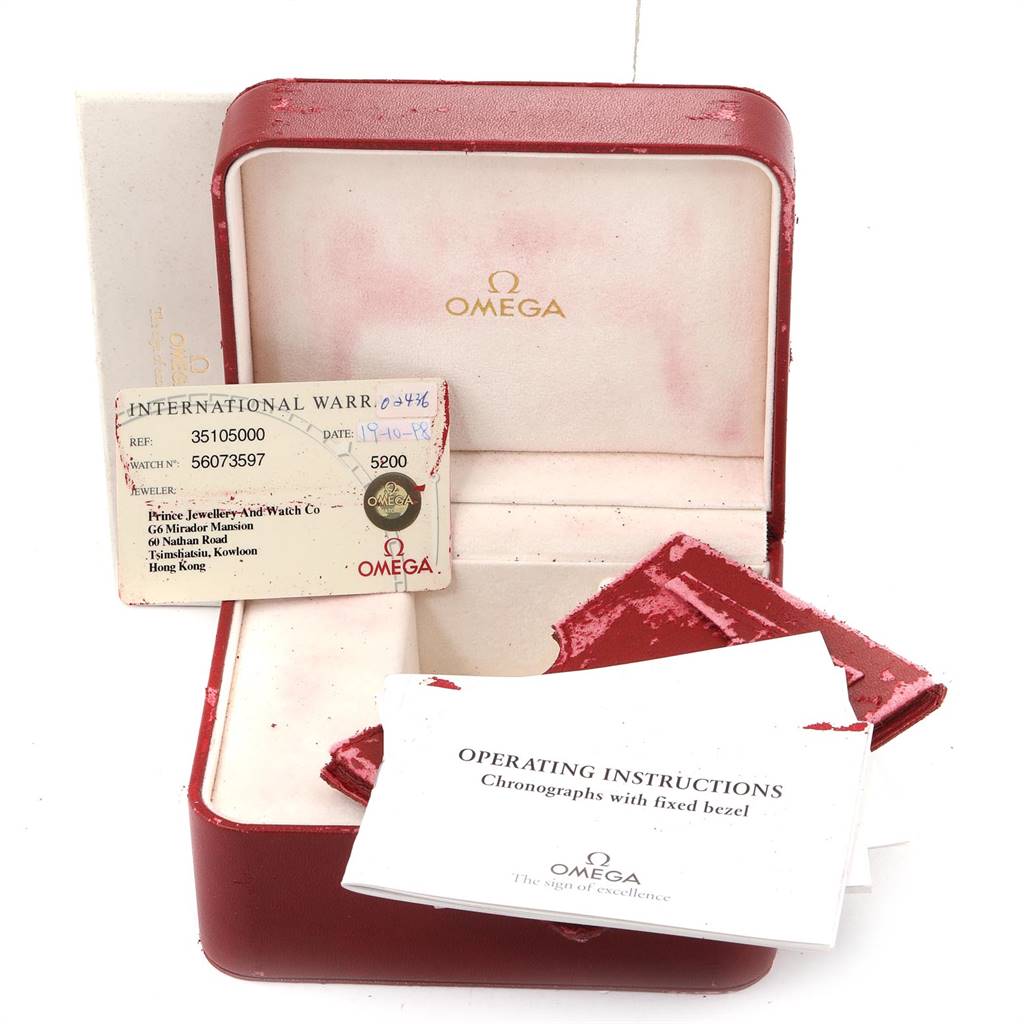 The image shows an Omega Speedmaster 3510.50.00 Men
s Stainless Steel Black Dial 3510.50.00 Men
s Stainless Steel Black Dial watch box, an international warranty card, and a booklet with operating instructions.